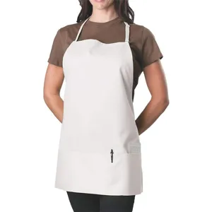 Close-up detail of the white kitchen apron showing front utility pockets and adjustable strap.