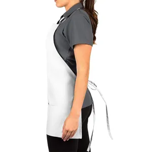 Professional white kitchen apron with pockets and adjustable straps for cooking and work.