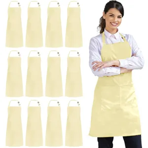 Close-up view of the light yellow polyester work apron featuring a front pocket and neck strap.