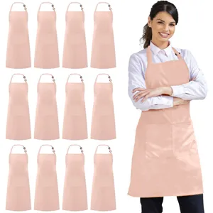 Pink polyester kitchen apron with front pocket and adjustable strap for baking and cooking detail