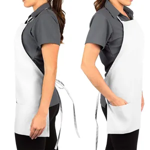 Adjustable white kitchen apron with pockets for restaurant chefs and cooking workwear use.