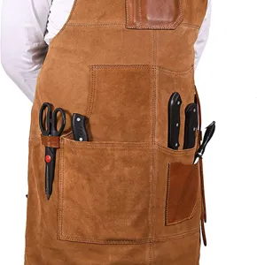 Heavy duty leather work apron with multiple tool pockets for kitchen BBQ and woodworking.