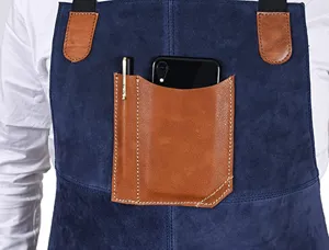 Blue suede apron detail showing contrast PU leather pocket and pen holder for workwear.
