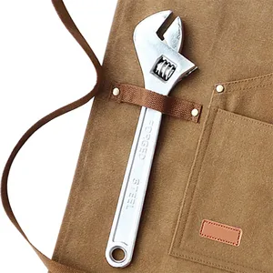 Durable brown canvas work apron with multi pockets, tool loops and adjustable wrench.