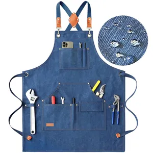 Heavy duty denim work apron with multiple tool pockets, cross back straps and waterproof fabric detail.