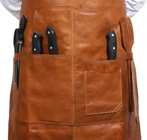 Leather apron detail showing multi-functional front pockets and convenient slots for tools.