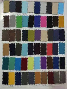 Fabric color swatch card displaying various PU leather options for custom aprons and workwear.