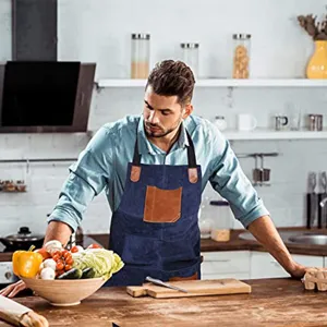 Denim kitchen apron with PU leather pockets and straps for cooking, baking and BBQ work.