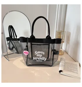 Black mesh transparent tote bag detail view, showing large capacity and stylish design.