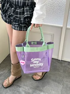 Transparent mesh tote bag for women, large capacity purple handbag with green handle.