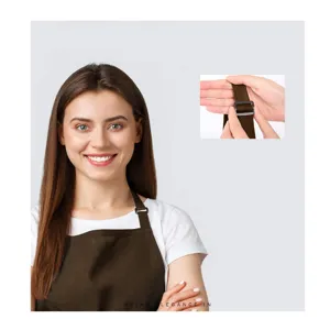 Close-up detail of adjustable neck strap buckle on dark brown kitchen apron fabric.