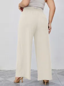 Vista posteriore dettaglio pantaloni larghi beige in seta di ghiaccio vita alta cordoncino.