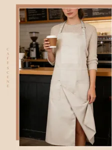 Beige cotton canvas work apron with multiple pockets and front split for cafe baristas.