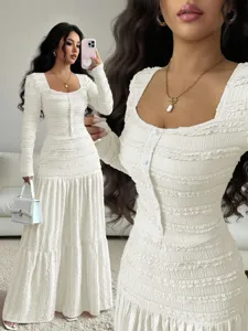 Elegant white long sleeve maxi dress featuring a square neckline, button front, and textured fabric.