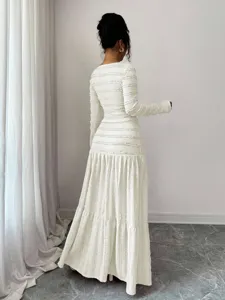 Elegant white textured long sleeve maxi dress featuring a chic square neckline and slim fit.