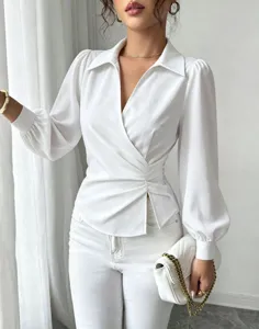 Detailed shot of French lapel V-neck wrap waist tie white blouse, elegant long bishop sleeves.
