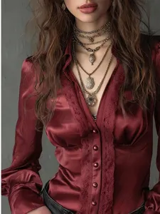 Burgundy satin long sleeve blouse with lace trim and vintage layered necklaces for women.