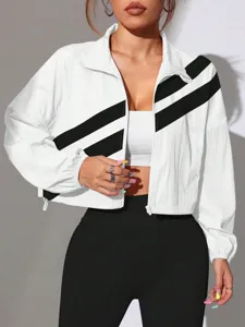 White crop zip-up jacket featuring stylish black diagonal stripes, stand collar, and trendy short fit.