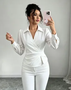 French lapel V-neck wrap waist long sleeve white blouse detail view showing slim fit.