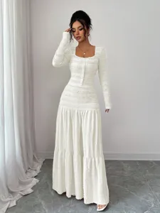 White textured long-sleeve maxi dress detail, elegant square neck design with stylish buttons.