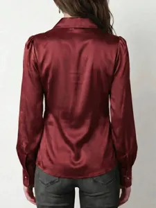 Back view detail of the elegant burgundy satin long sleeve blouse featuring chic collar design.