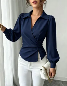 Detailed view of the elegant navy blue wrap blouse featuring a chic lapel and V-neckline.