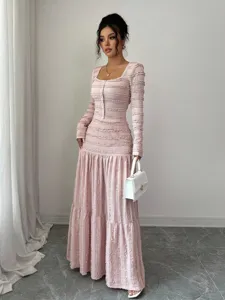 Pink square neck long sleeve maxi dress with textured button details for elegant women fashion.
