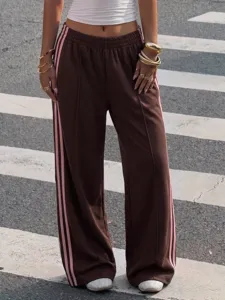 Brown Y2K high waist wide leg track pants with pink side stripes, casual streetwear detail.