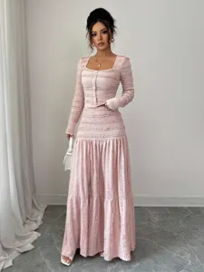 Elegant pink textured long sleeve maxi dress featuring square neck and single breasted buttons.