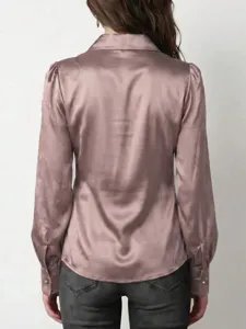Detailed view of women's satin long sleeve blouse featuring lapel collar and button cuffs.