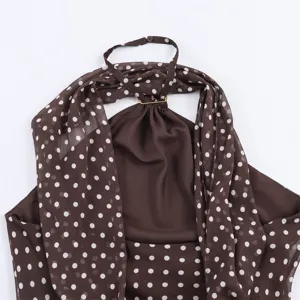 Detailed close-up view of the brown polka dot halter top with scarf and metal ring.