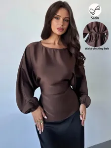 Chic satin long-sleeve blouse for women featuring a stylish crewneck and waist-cinching belt.