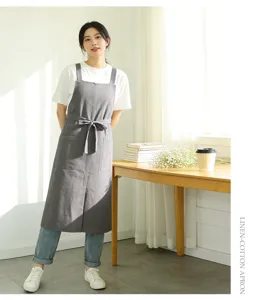 Linen cotton kitchen apron with pockets and ties, stylish grey design for daily cooking use.