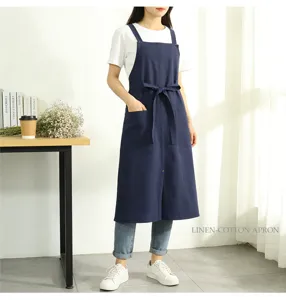 Linen cotton apron with pockets and cross straps, vintage style workwear for kitchen and cafe.