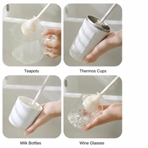 Brosse de nettoyage en silicone à long manche pour tasses bouteilles thés et bébés.