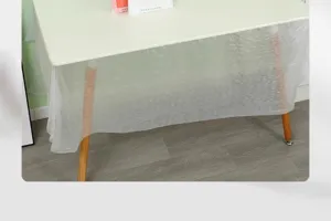 Disposable transparent plastic tablecloth detail view, waterproof table cover for home.
