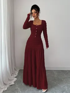 Burgundy long sleeve maxi dress featuring a square neckline, ruched details, and button front.