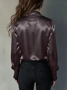 Detailed back view of women's satin long sleeve blouse in elegant dark purple tone.