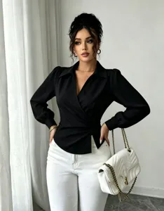 Close-up of elegant black wrap blouse featuring lapel V-neck, long sleeves and waist tie.