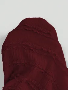 Wine red layered lace pleated fabric detail, elegant and stylish clothing accessory.