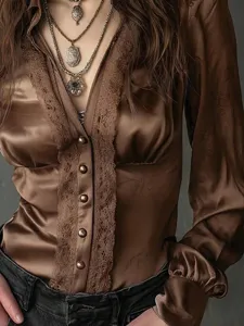 Close-up detail of women brown long sleeve satin blouse featuring vintage lace trim and V-neck.