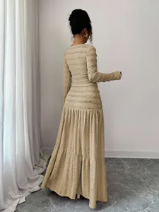 Long sleeve tiered maxi dress in beige with textured ruffled design for women detail view