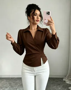 Close-up detail view of the stylish brown wrap blouse with lapel collar and fitted waist.