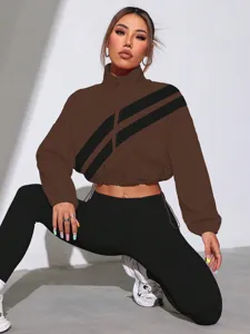 Detailed view of the brown cropped jacket with stylish diagonal stripes and comfortable fit.