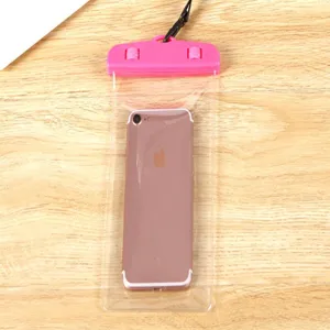 Waterproof phone bag detail showing clear transparent PVC and pink secure seal clip.