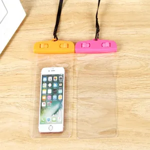 Detail shot of clear waterproof phone pouches with colorful clips, ideal for beach and swimming use.