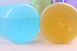 Frosted plastic water bottle bottom detail, durable portable sports cup design, vibrant candy color.