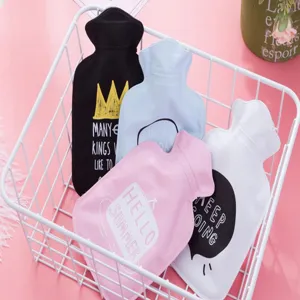 Portable rubber hot water bag detail view, colorful winter warm hand pouch set in storage basket.