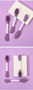 Pinceau double embout en silicone pour masque et boue, idéal pour une application hygiénique.