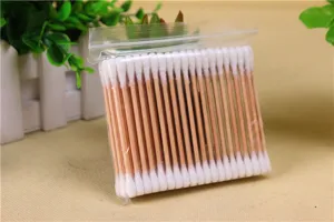 Close up detail of double ended wooden cotton swabs in clear pouch for daily use cleanup.